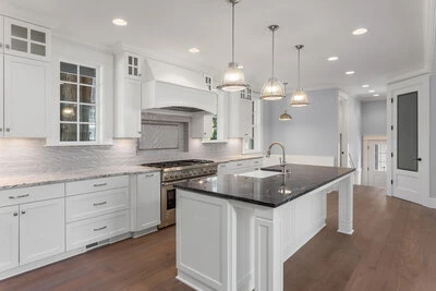 Beautiful kitchen with white cabinets and kitchen island.