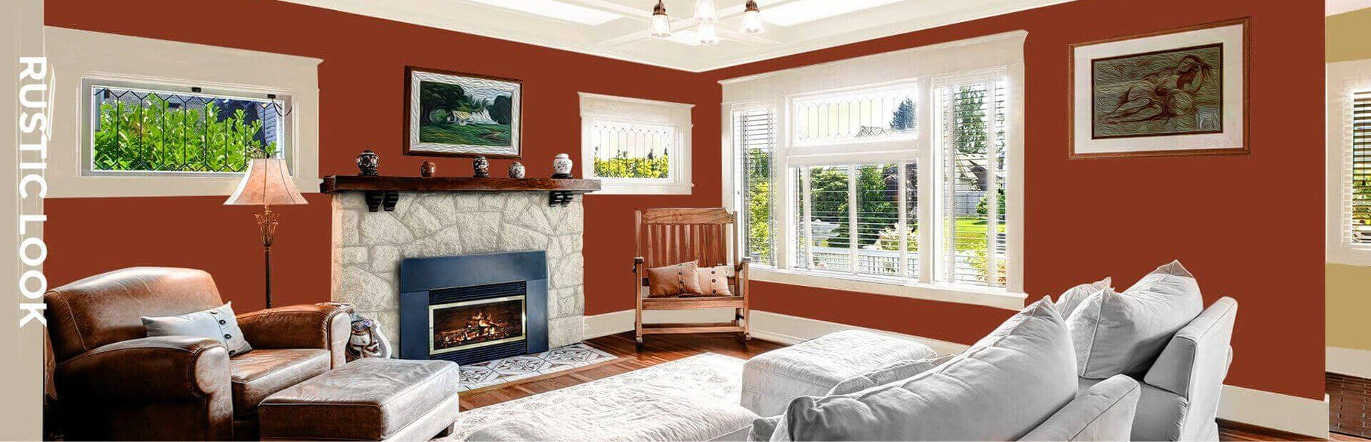 Rustic style living room in tan, red, and brown, featuring furniture and paintings on walls.