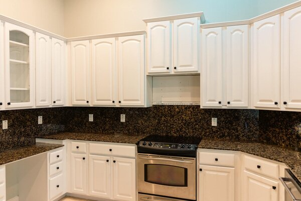 White kitchen cabinets painted by Five Star Painting of Tampa Bay
