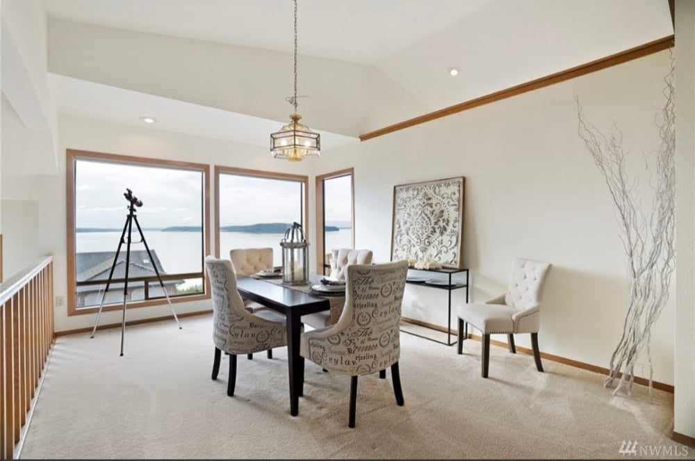 Dining Room with dining table and chairs with a window with water view