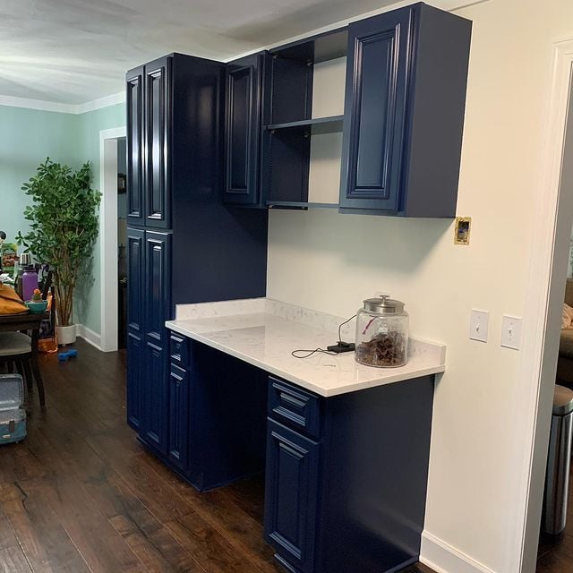 Blue kitchen cabinets with white countertop