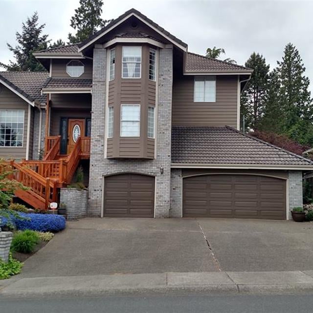 Exterior House with Sherwin Williams Dark Brown Garage Doors