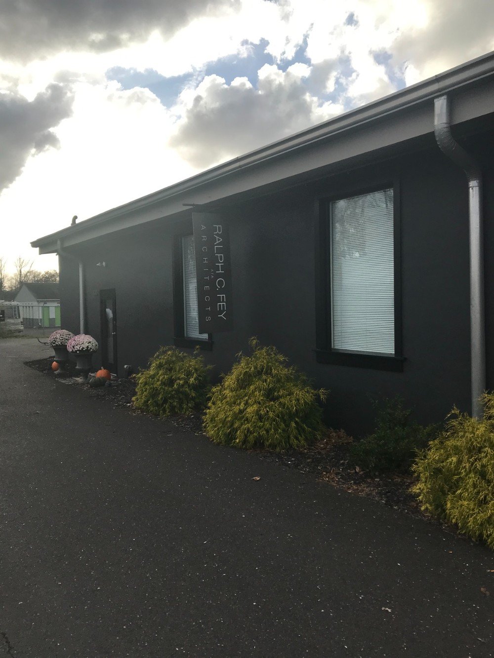 front entrance commercial building dark gray stucco