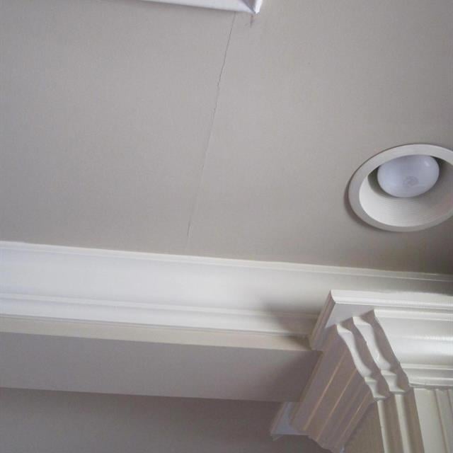 Crown moulding on ceiling.