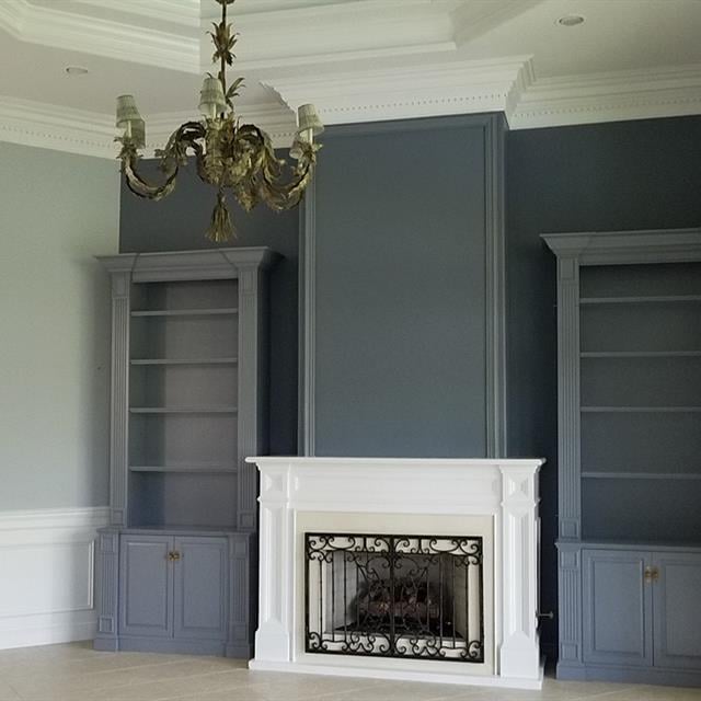 Fireplace and cabinetry painted blue and white