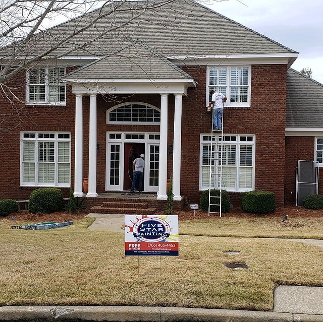 brick house with white accents and trim