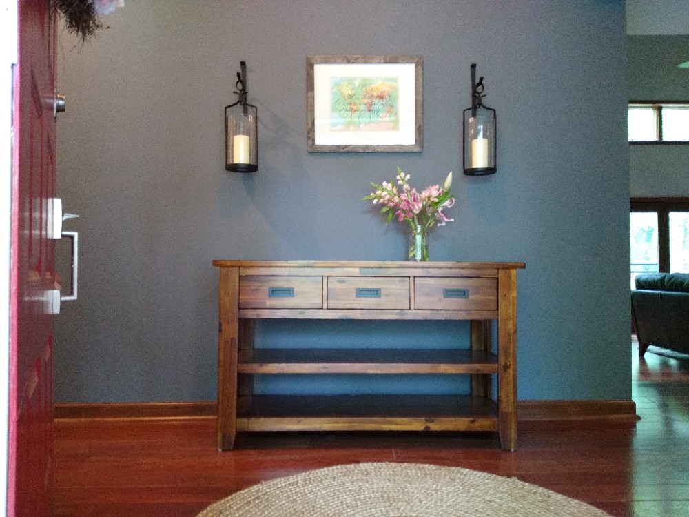 Dark gray foyer walls wood floors