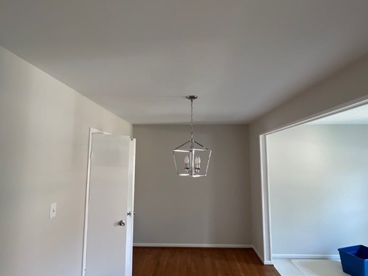 Grey Renewed Grey Dining Room with Contrasting White Trim and New Chrome Lighting