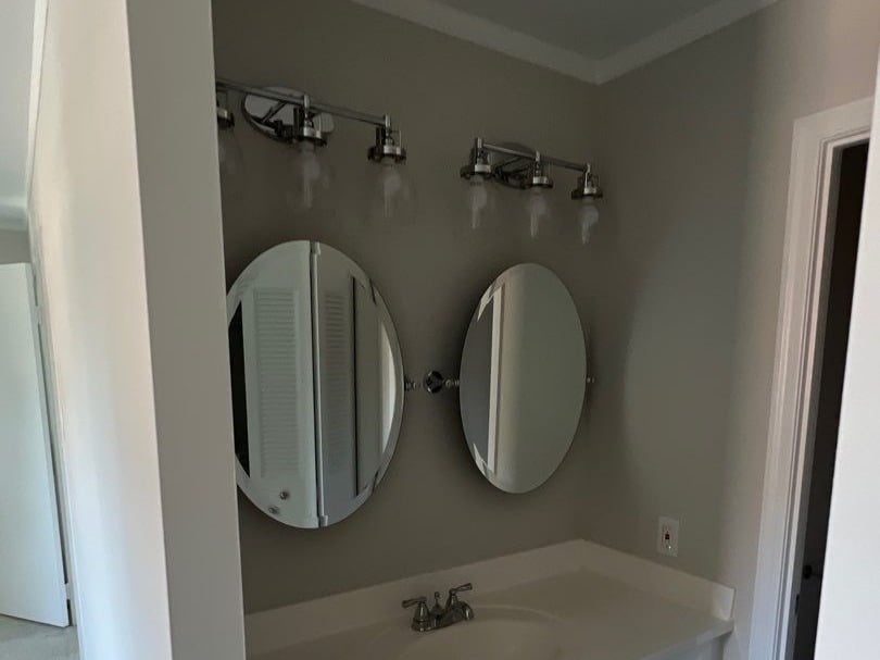 Grey Master Bath Vanity with New Oval Mirrors and Modern Updated Lighting