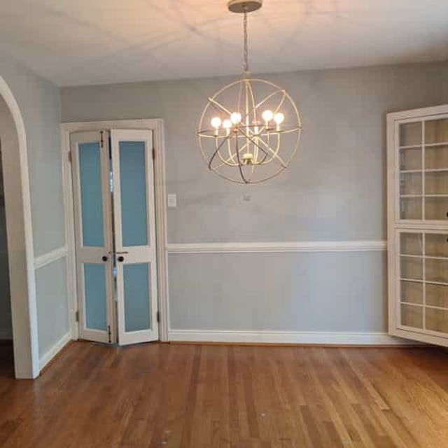 gray dining room with hanging light fixture