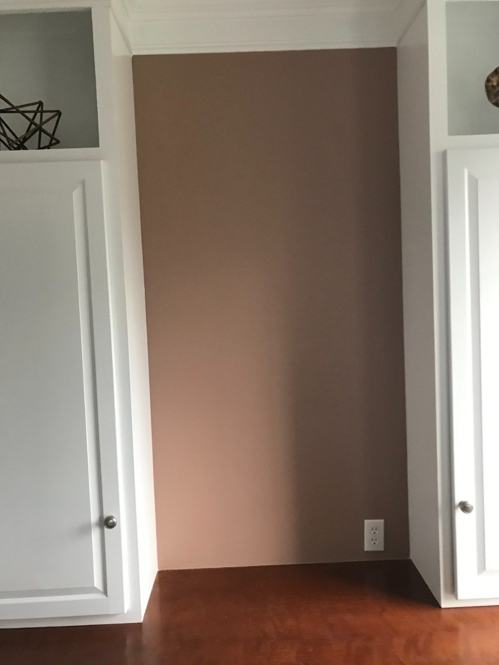 White cabinets wood floors light Red walls