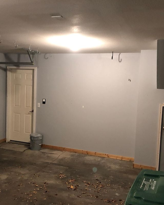 Interior painting in garage with natural wood trim