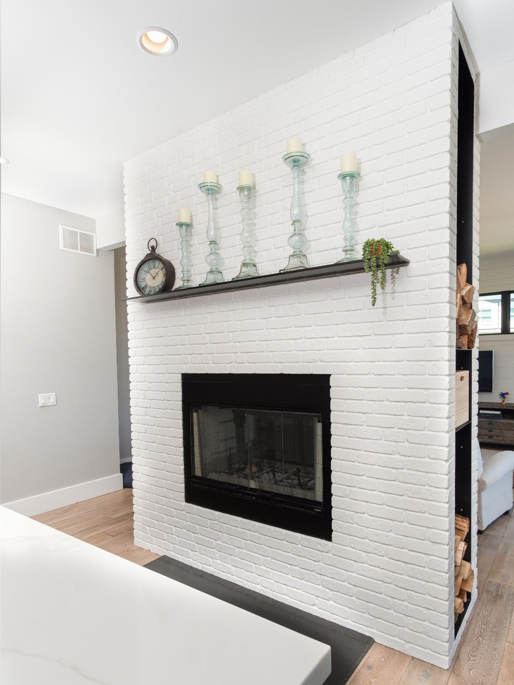 White brick fireplace, showcasing the exquisite workmanship of our Five Star Painting services in Pigeon Forge, TN