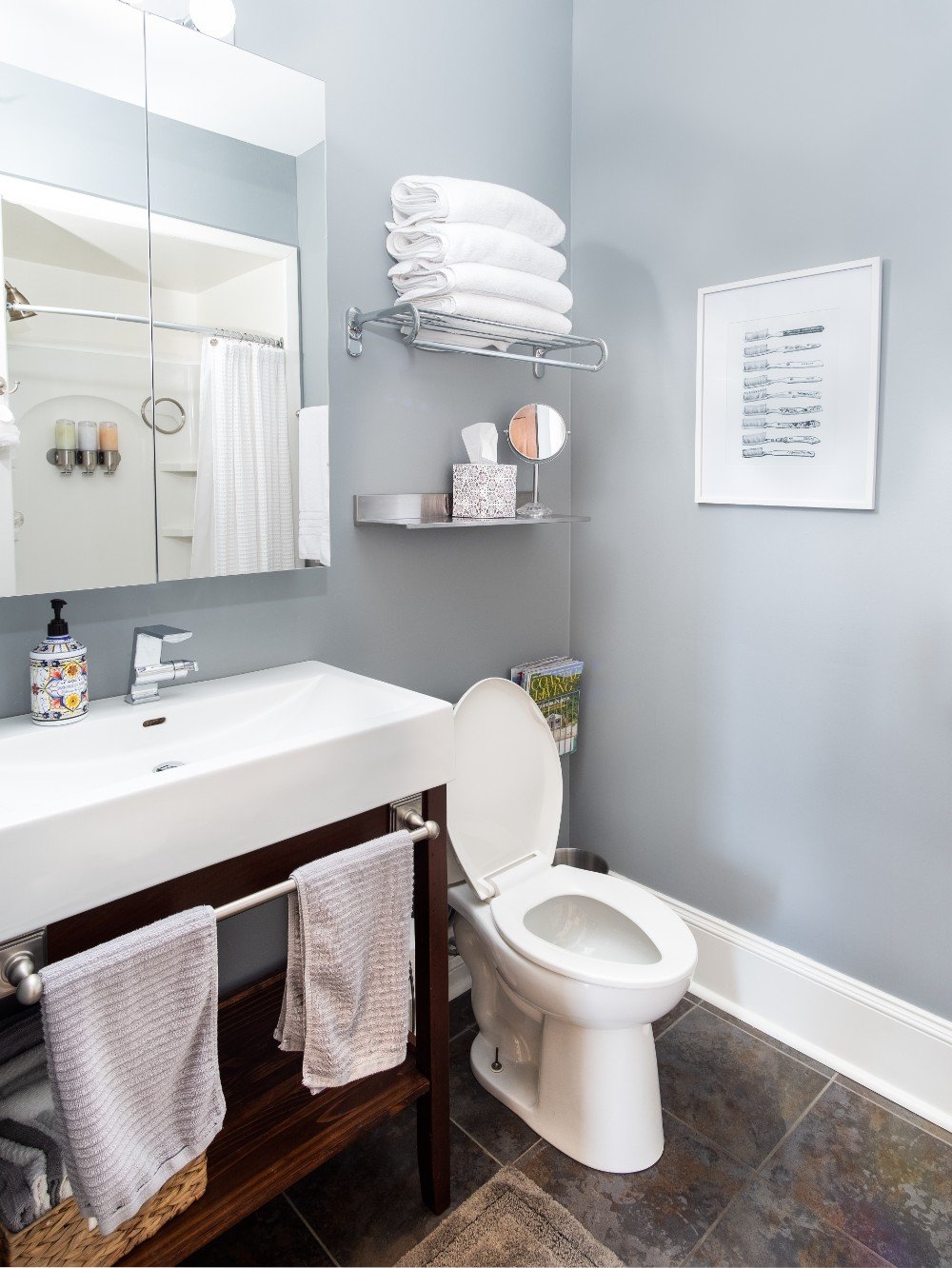 Chic bathroom with elegantly painted gray walls and crisp white trim, exemplifying the meticulous attention to detail provided by our Five Star Painting services in Cranberry, PA