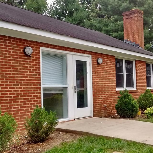 Painted White Soffit and Fascia for a Red Brick Home