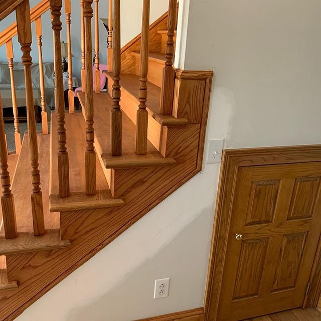 Stained wooden stairwell custom match