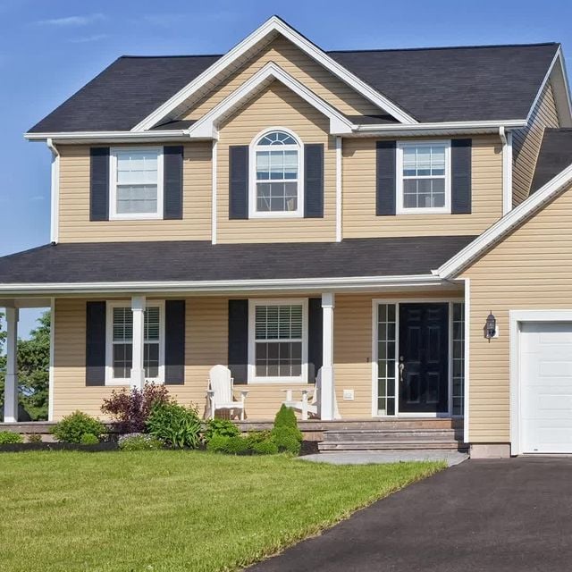 Tan house with black and white accents