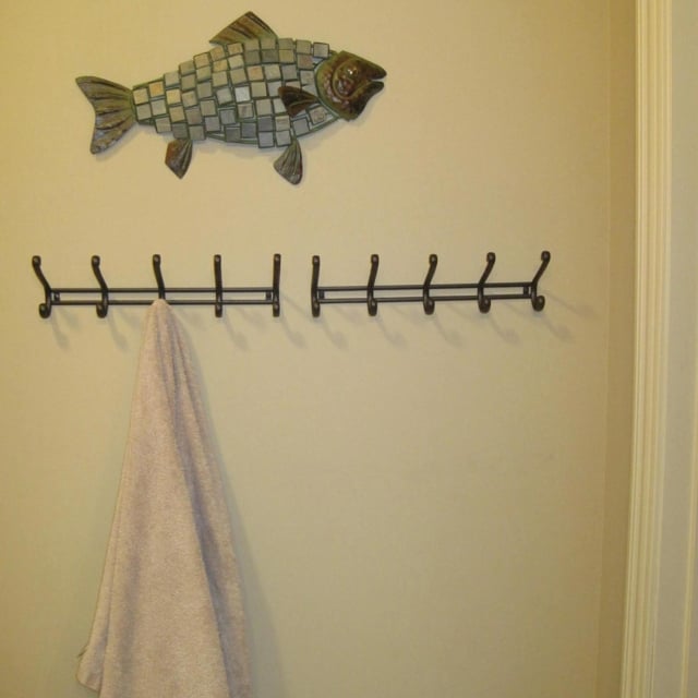 Towel hanging from rack on wall