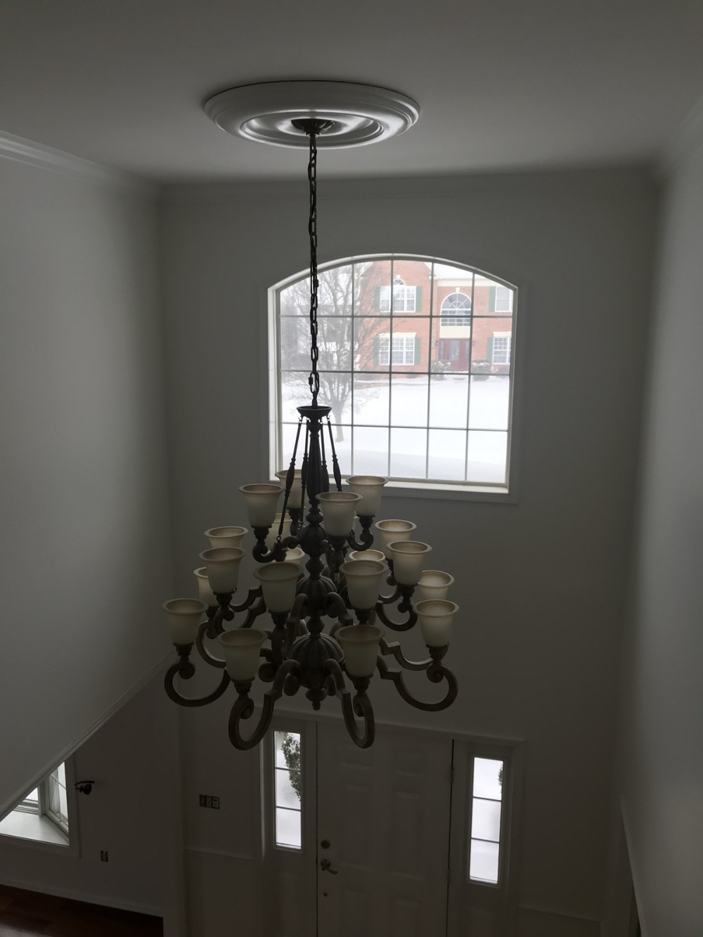 White walls two story home entrance foyer