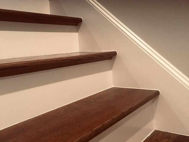 White and hardwood stairs