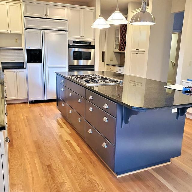 White kitchen cabinets with blue painted kitchen island