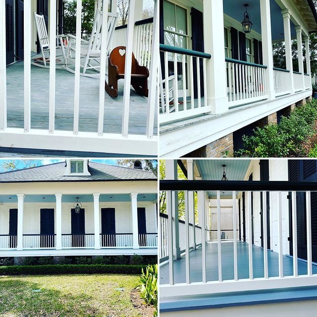 White porch with a black hand rail