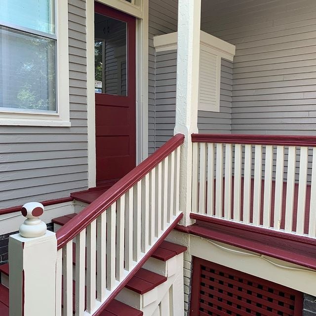 before and after red and white railing on a grey house