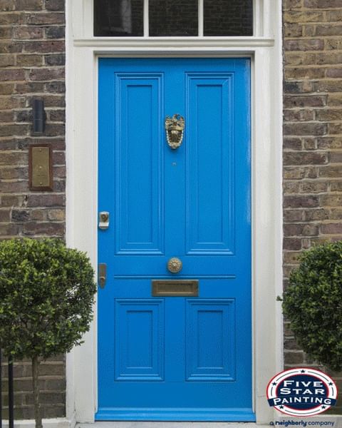 bright blue door brick wall