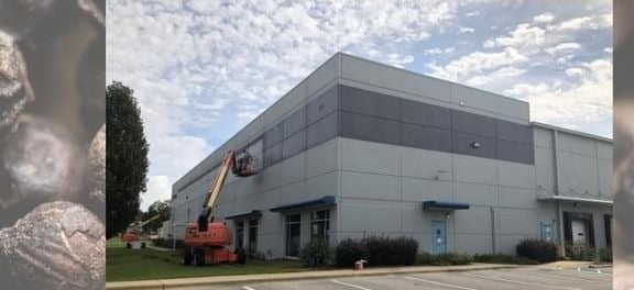 commercial building with crane out front