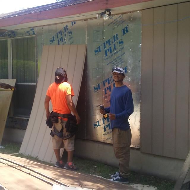 employees installing siding