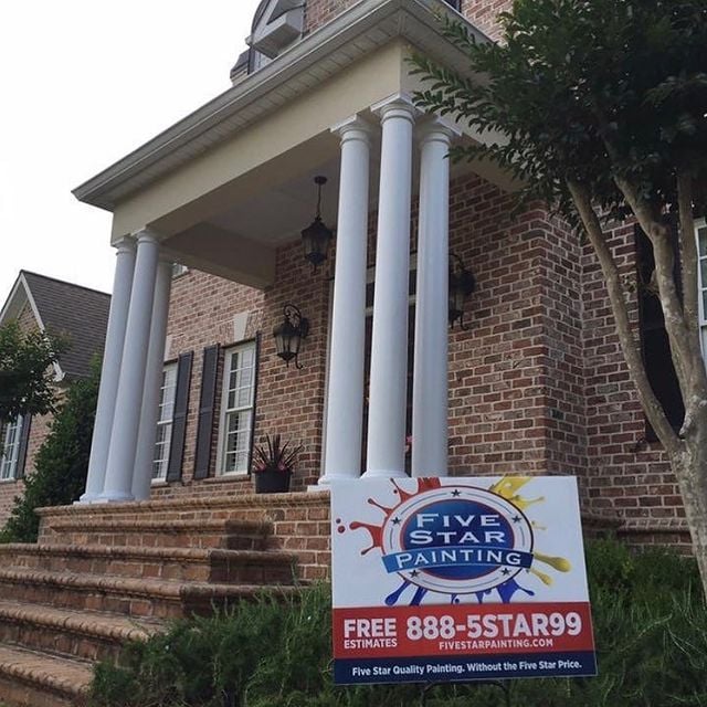 entranceway with painted white columns