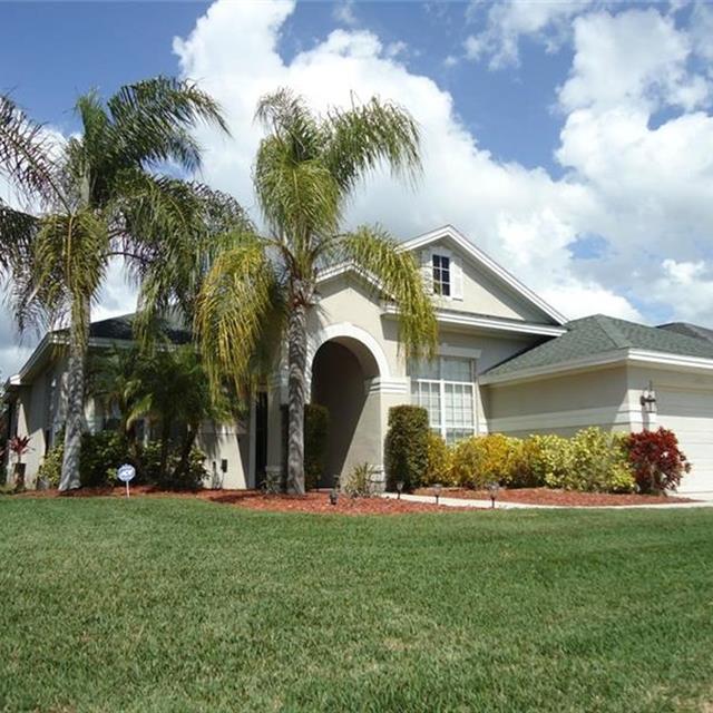 exterior of home with palm trees