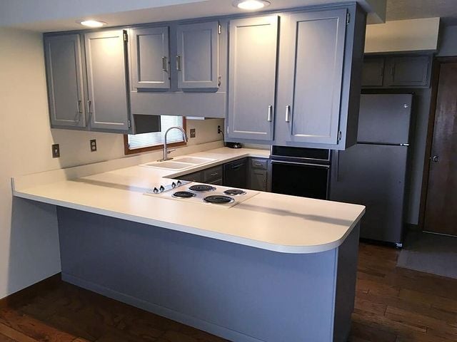 gray cabinets with white counter top