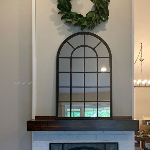 grey walls mirror above fireplace