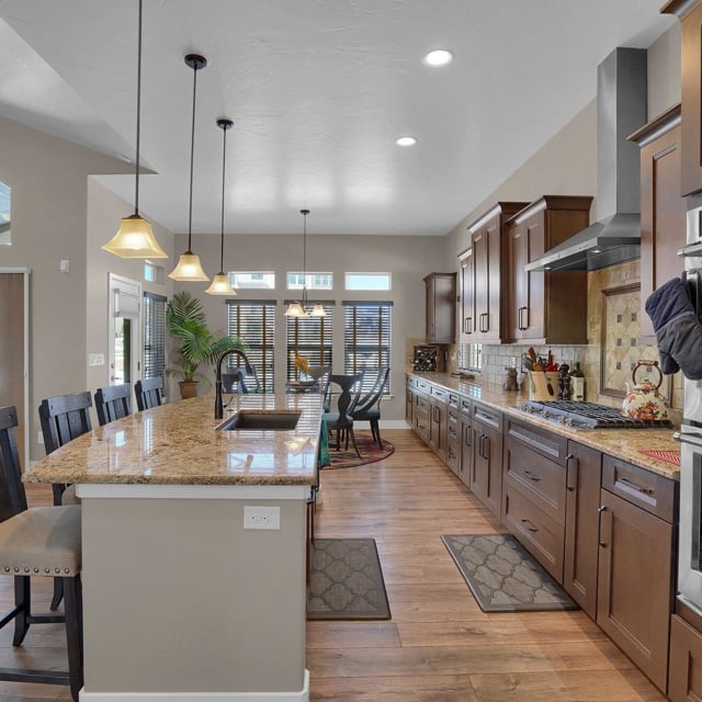 home kitchen with tile counter tops and wood cabinets