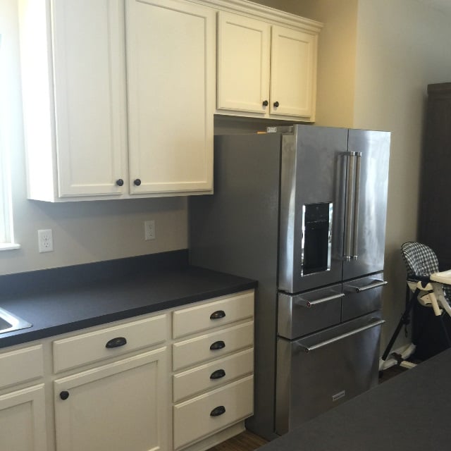 kitchen cabinets surrounding refrigerator