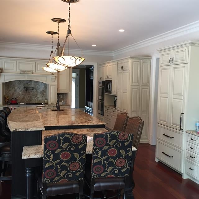 kitchen island with several bar stools