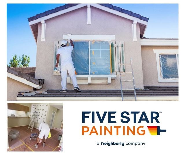 man painting a house