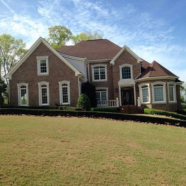 painted white trim on two story home