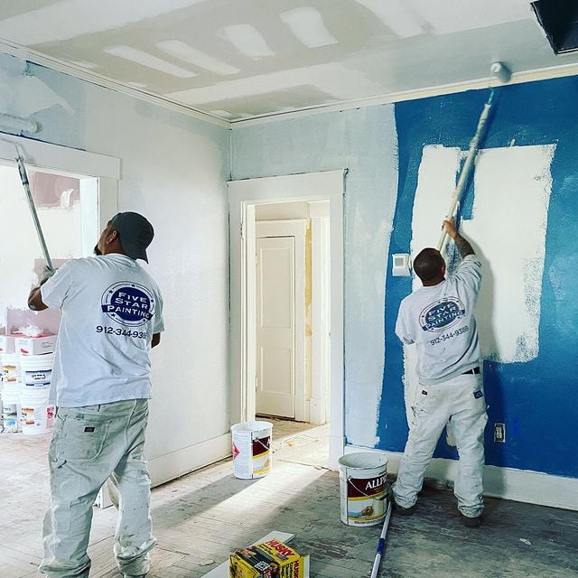 painters painting walls