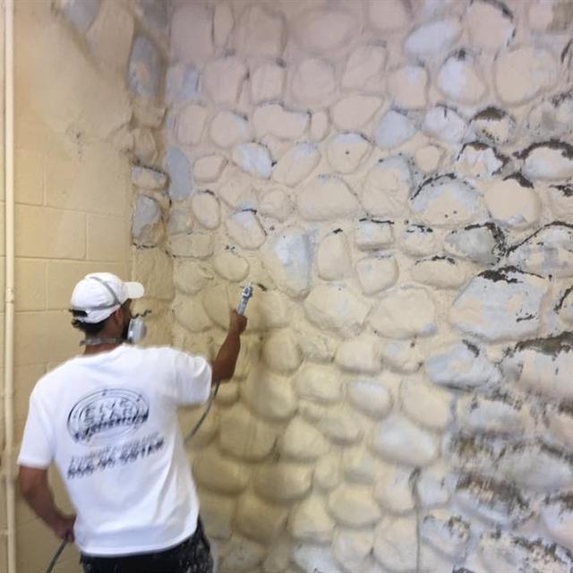 painting rock wall