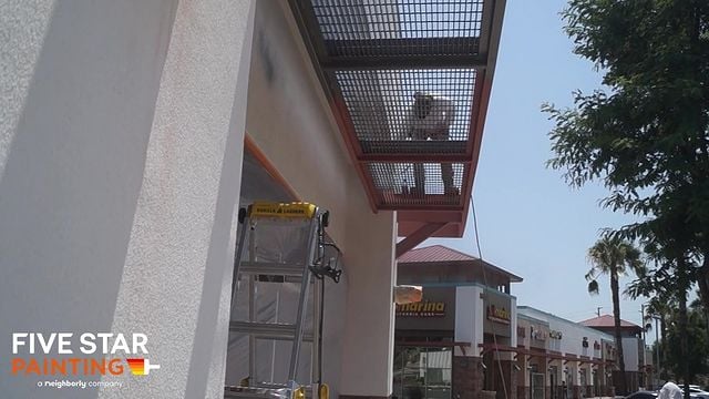 tech painting a grate