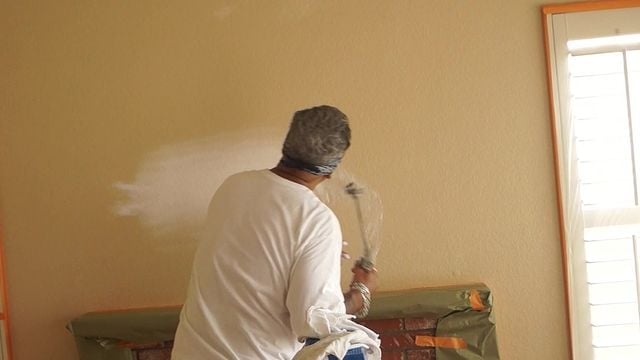 tech painting a wall