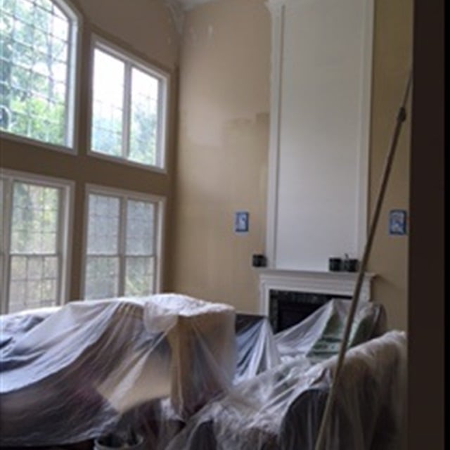 two-story fireplace wall paint in progress