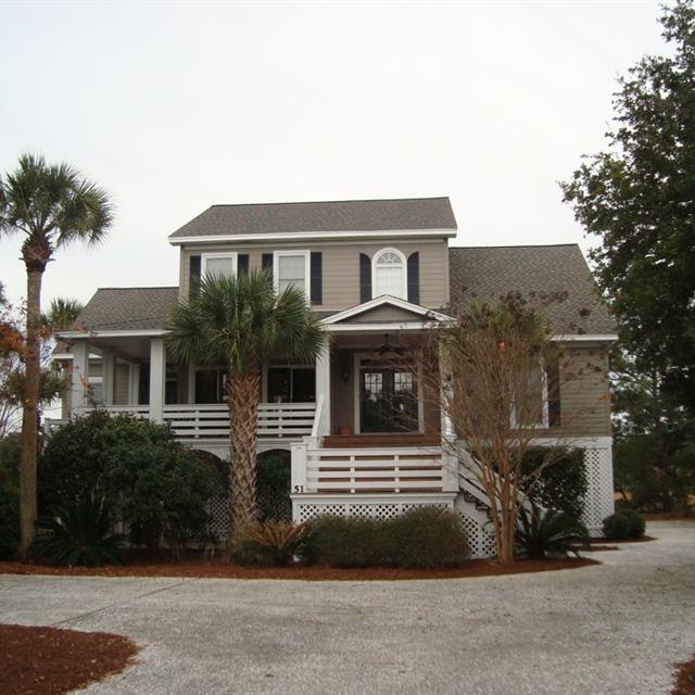 two story home in tan and white trim