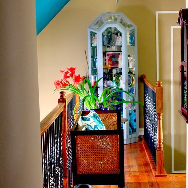 upstairs landing with high contrast accents and white trim