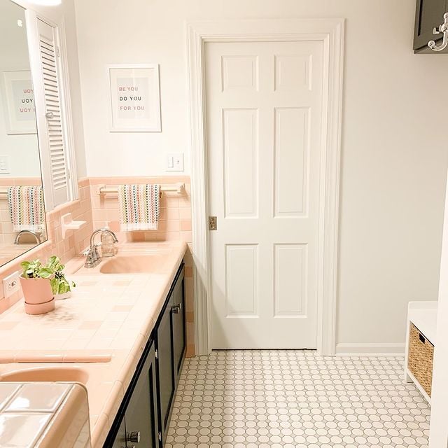 white bathroom with tile flooring