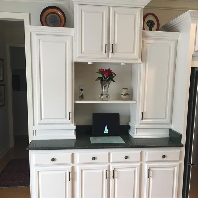 white cabinets with dark granite counter