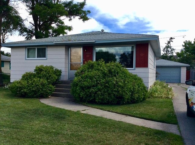 white exterior home with blue garage door