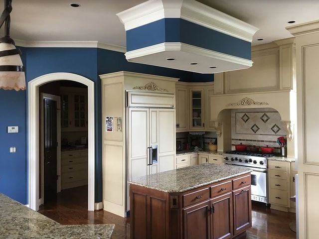 white kitchen cabinets and blue walls